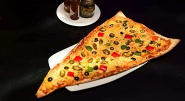 Love Pizza? Treat Yourself & Your Pals With The Biggest Pizza Slice Ever!